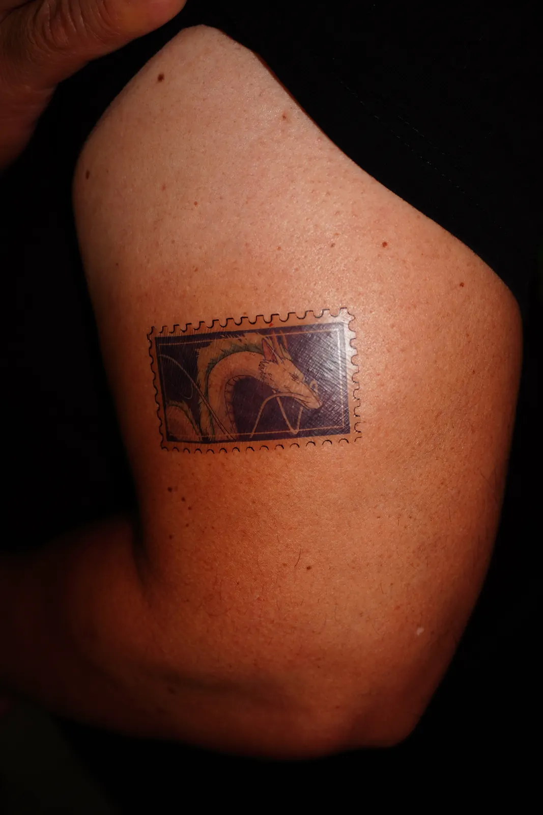 Postage-stamp temporary tattoo of Haku the dragon (Spirited Away), applied on the arm