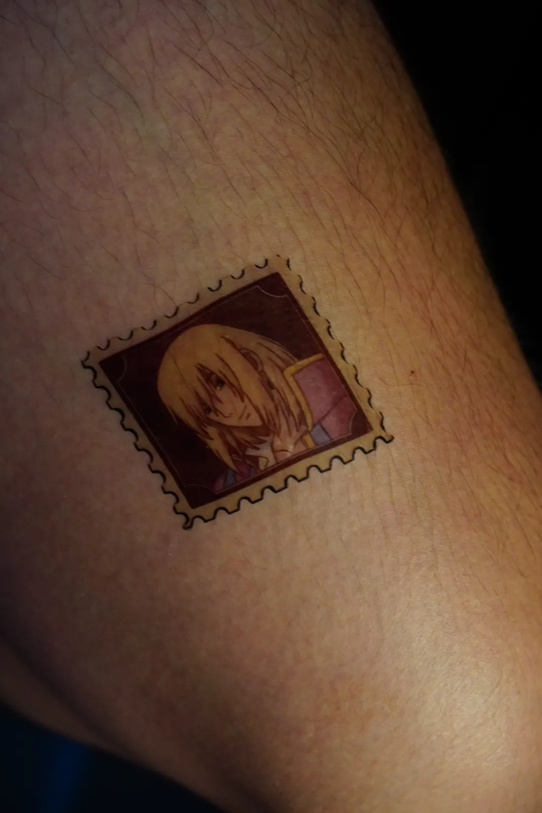 Postage-stamp temporary tattoo of Howl (Howl's Moving Castle), applied on the leg