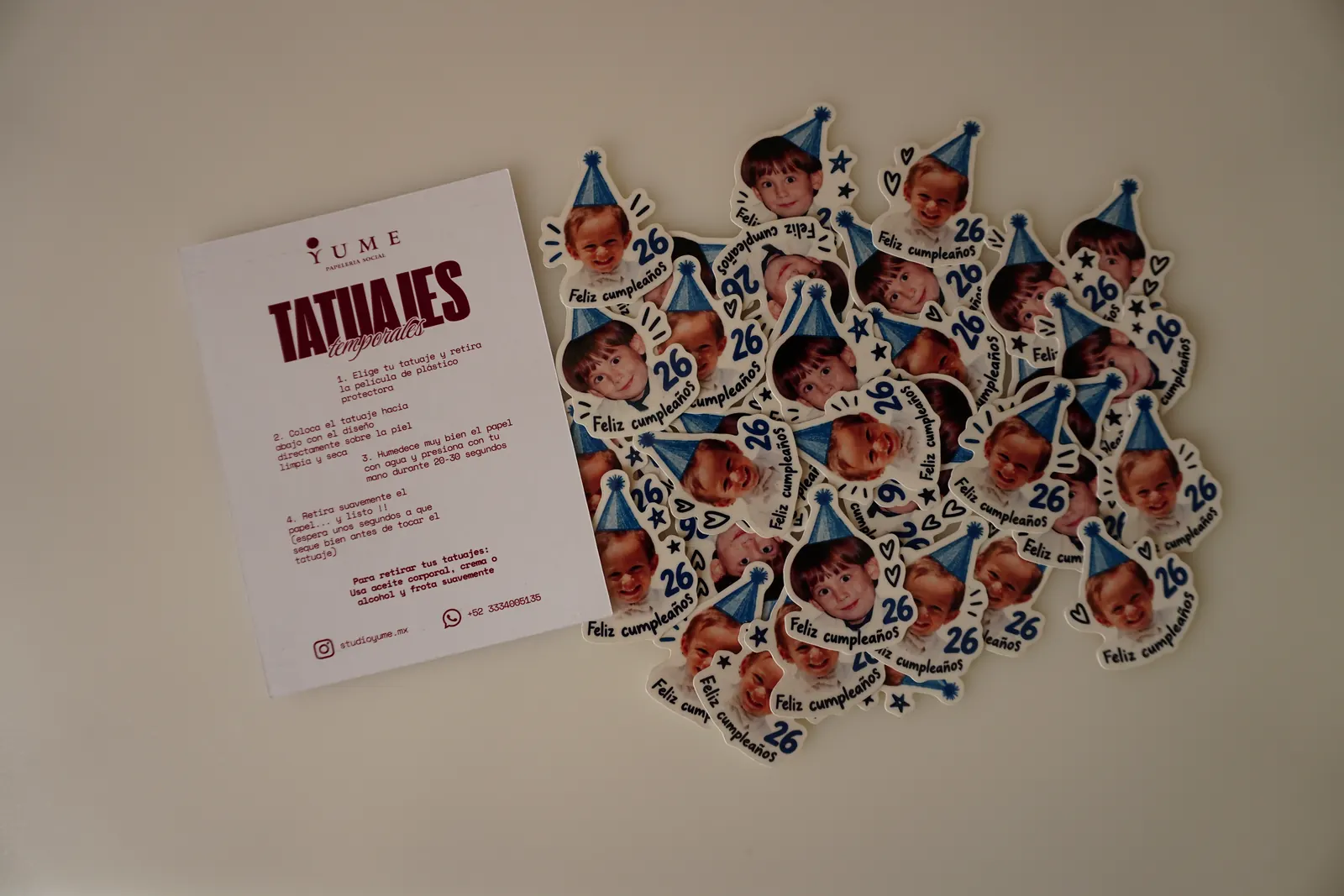 Cut-out birthday temporary tattoos next to the Yume instruction card