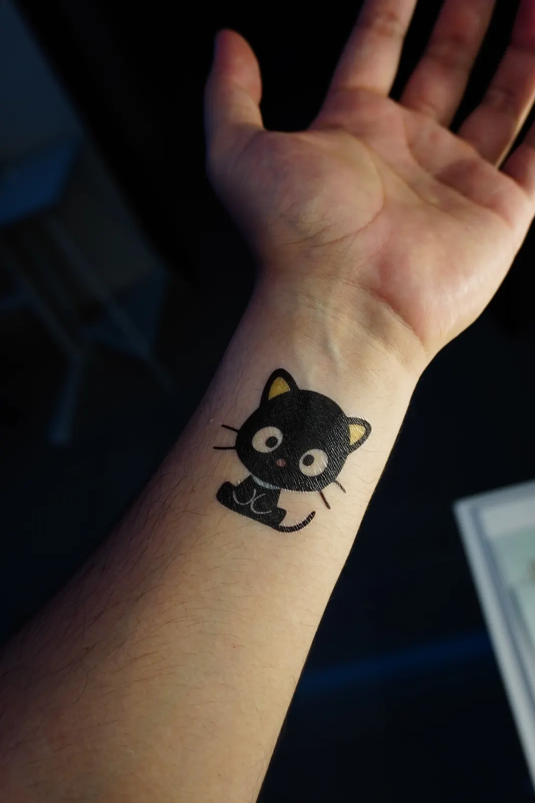 Chococat, Sanrio's black cat, as a temporary tattoo on the wrist